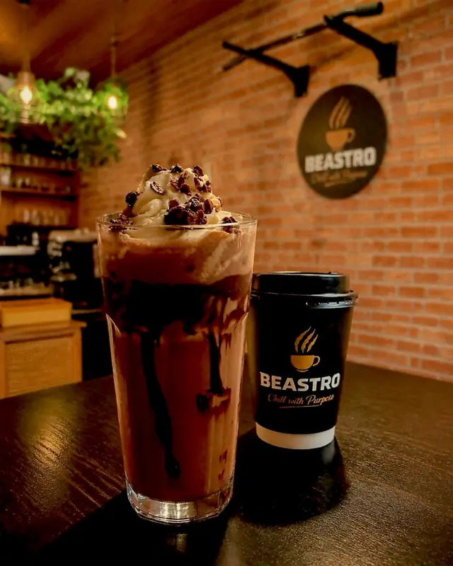 Chocolate shake next to a Beastro cup